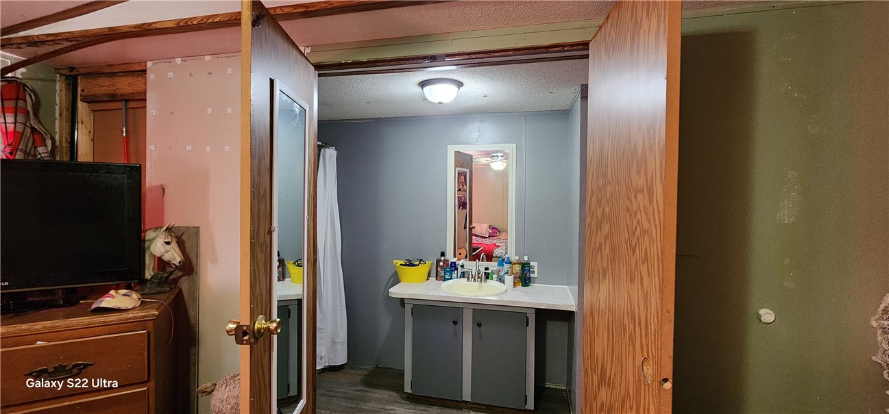 326 Doyle Street Westminster, SC 29693 - Photo 13 of 26 This functional bathroom features a vanity with ample storage and a clear mirror.