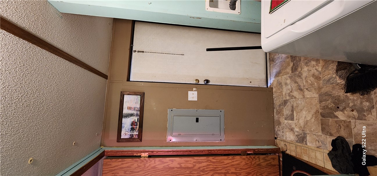 326 Doyle Street Westminster, SC 29693 - Photo 14 of 26 This functional utility area features vinyl flooring and provides a dedicated space for laundry.