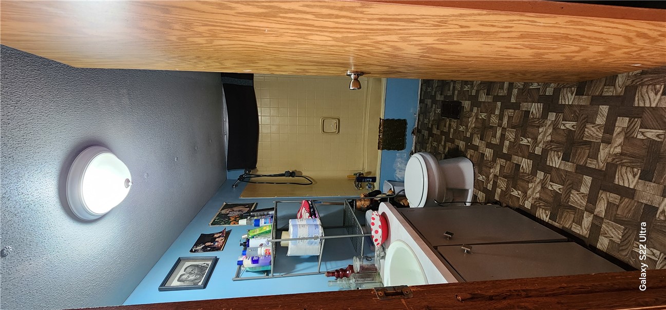 326 Doyle Street Westminster, SC 29693 - Photo 18 of 26 This functional bathroom features a shower-tub combination and practical vinyl flooring.