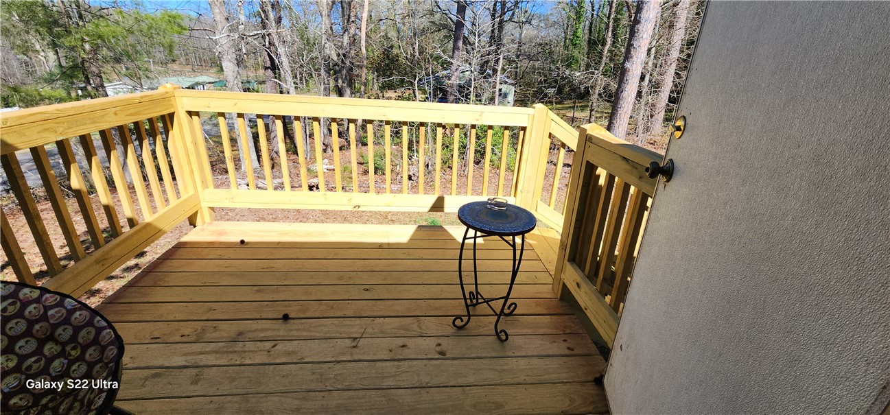 326 Doyle Street Westminster, SC 29693 - Photo 19 of 26 Enjoy outdoor living on this wooden deck, perfect for relaxation and enjoying the natural surroundings.