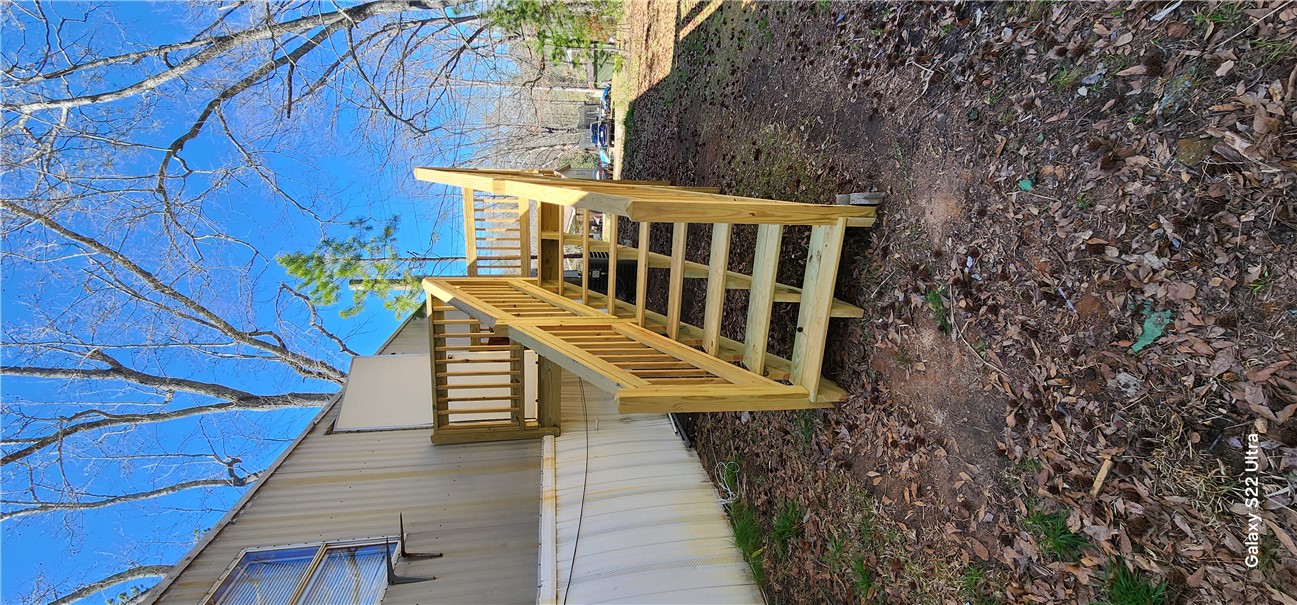 326 Doyle Street Westminster, SC 29693 - Photo 21 of 26 This residence features a wood deck and stairs, providing convenient outdoor access.