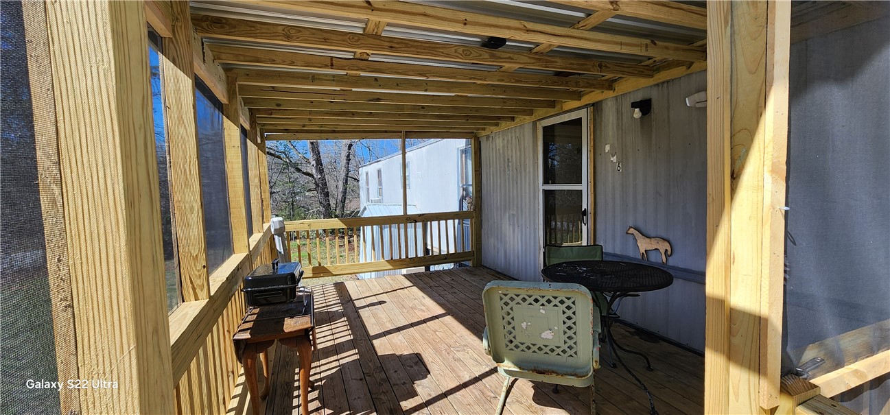 326 Doyle Street Westminster, SC 29693 - Photo 6 of 26 Enjoy tranquil outdoor living on this inviting screened porch, perfect for relaxation and fresh air.