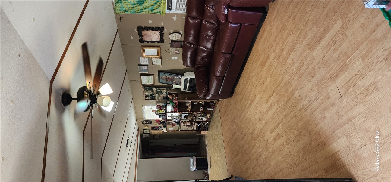 326 Doyle Street Westminster, SC 29693 - Photo 8 of 26 This inviting living area features warm flooring and a ceiling fan for comfort.