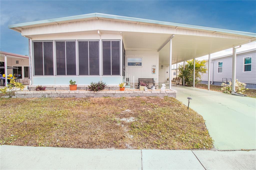 5619 Bayshore Road, Unit 240 Palmetto, FL 34221 - Photo 1 of 33 a view of a porch with a backyard
