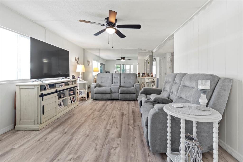 5619 Bayshore Road, Unit 240 Palmetto, FL 34221 - Photo 12 of 33 a living room with furniture and a flat screen tv