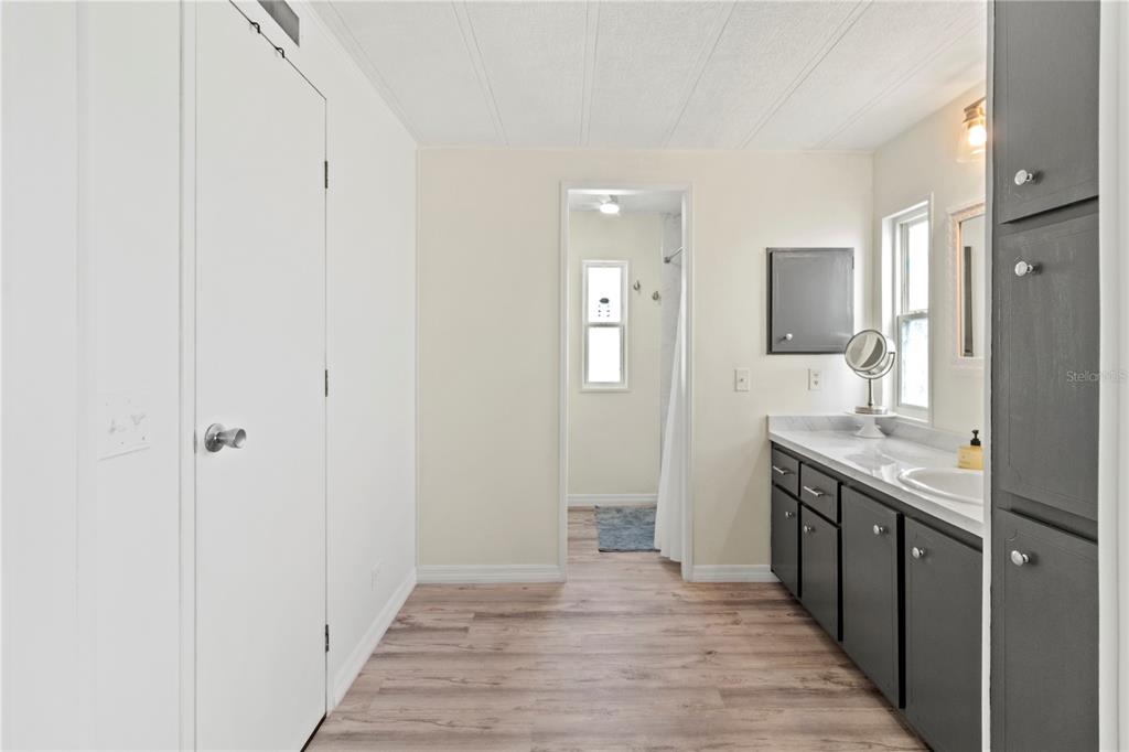 5619 Bayshore Road, Unit 240 Palmetto, FL 34221 - Photo 17 of 33 a spacious bathroom with a sink and a mirror