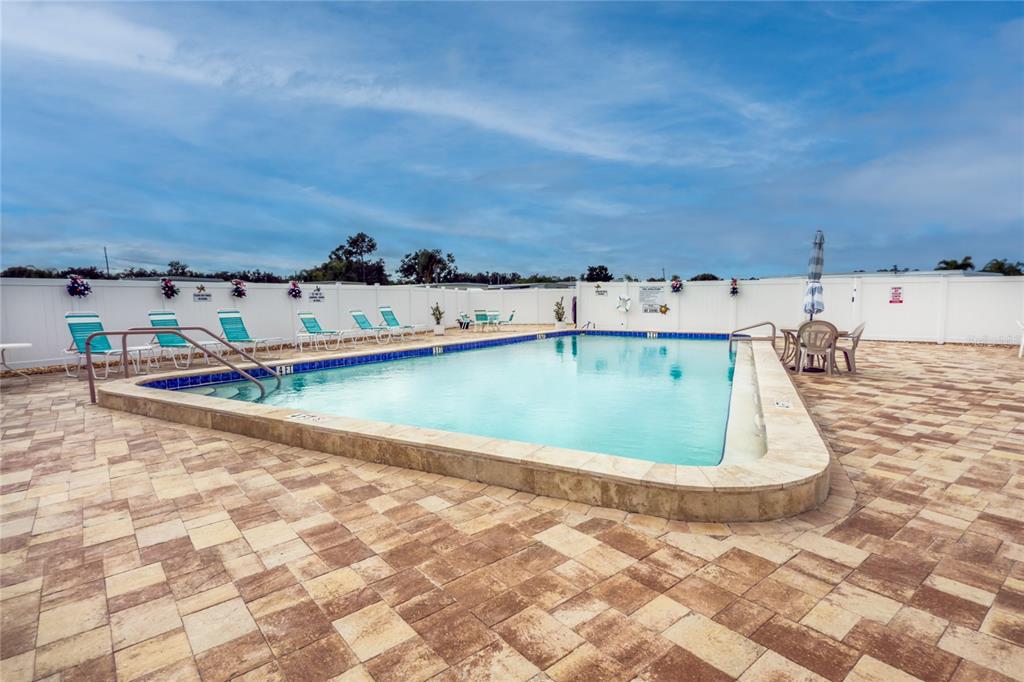 5619 Bayshore Road, Unit 240 Palmetto, FL 34221 - Photo 2 of 33 a view of swimming pool with a yard