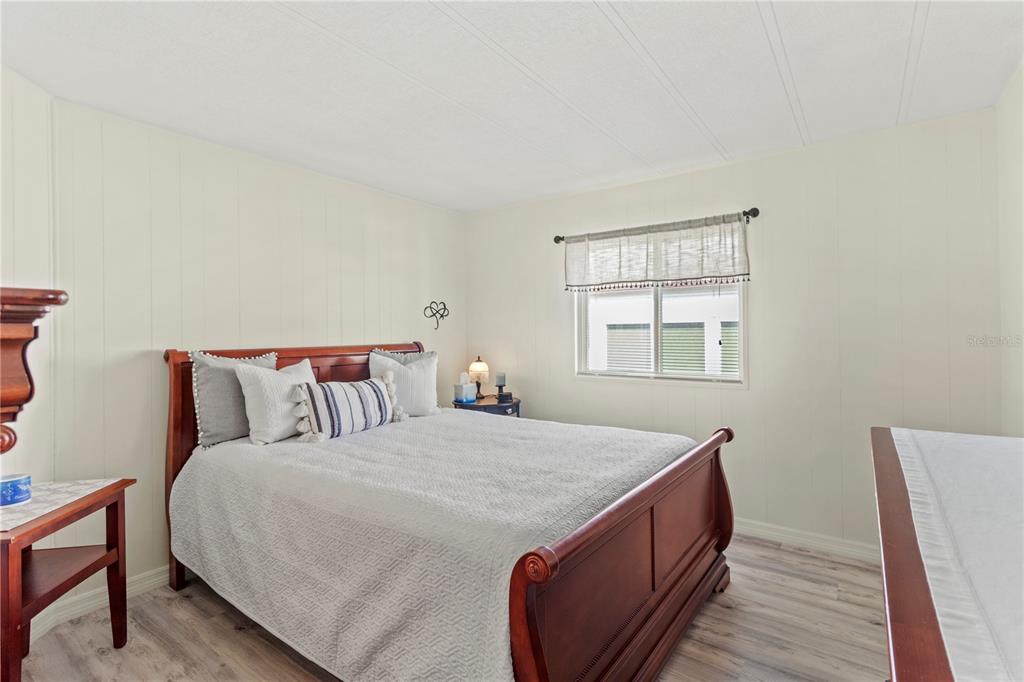 5619 Bayshore Road, Unit 240 Palmetto, FL 34221 - Photo 22 of 33 a bed sitting in a bedroom next to a window