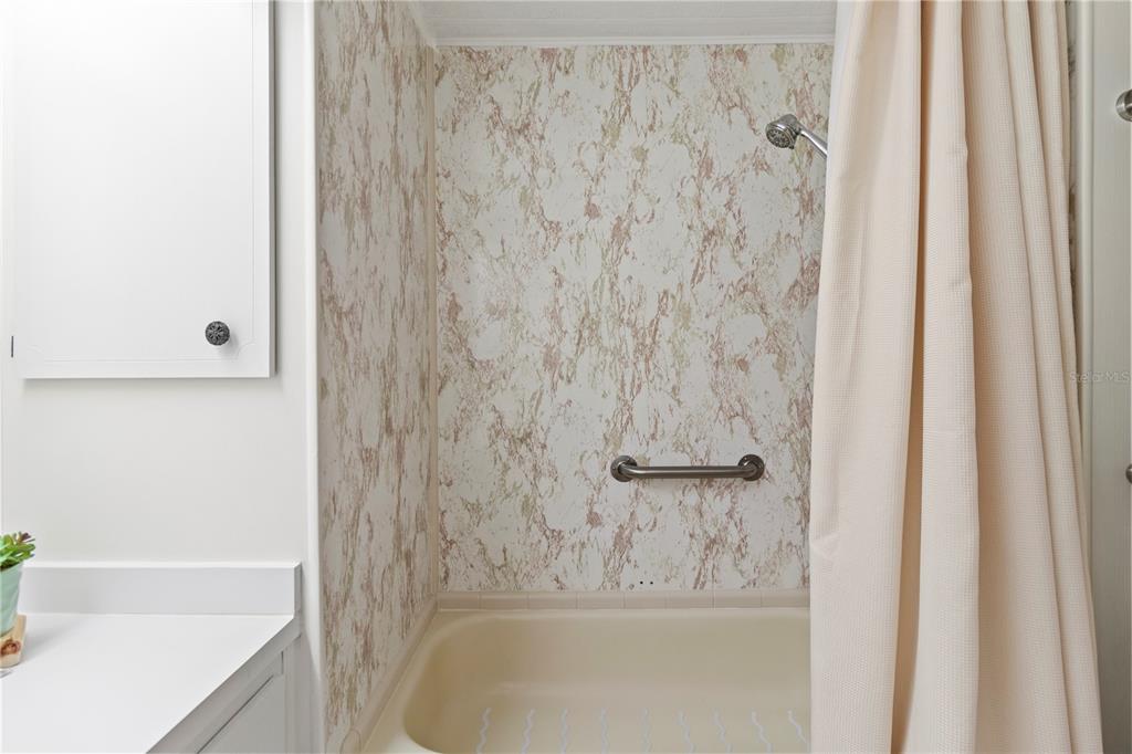 5619 Bayshore Road, Unit 240 Palmetto, FL 34221 - Photo 25 of 33 a bathroom with a bathtub and shower