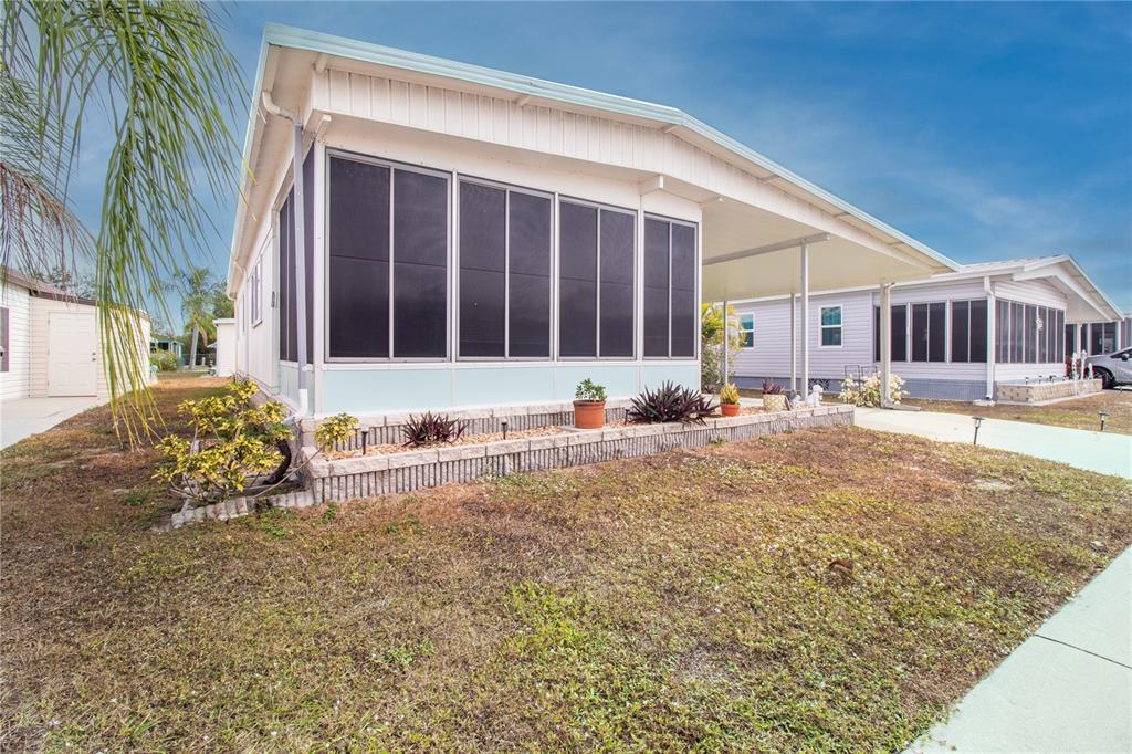 5619 Bayshore Road, Unit 240 Palmetto, FL 34221 - Photo 28 of 33 a front view of a house with a yard