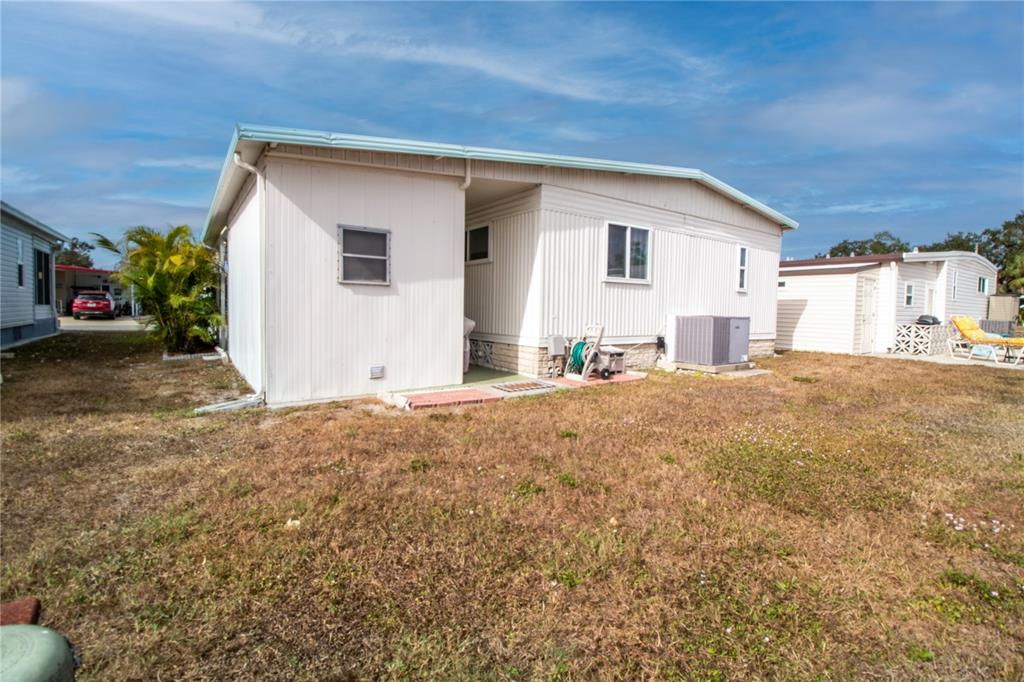 5619 Bayshore Road, Unit 240 Palmetto, FL 34221 - Photo 29 of 33 a view of a house with a backyard