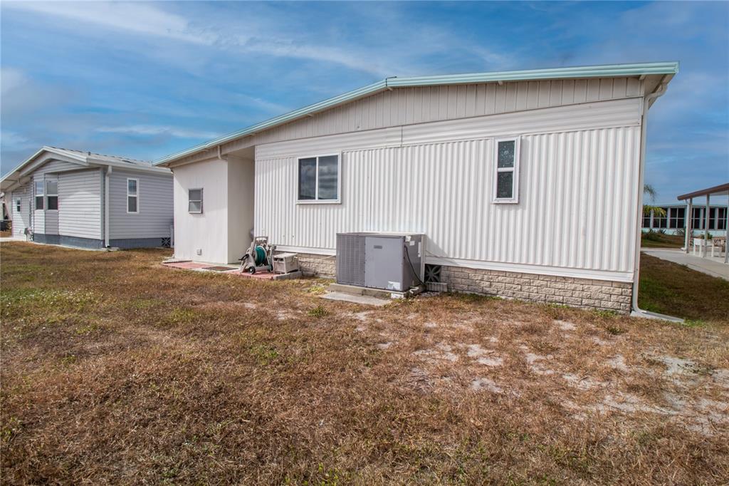 5619 Bayshore Road, Unit 240 Palmetto, FL 34221 - Photo 30 of 33 a view of a house with backyard and a area