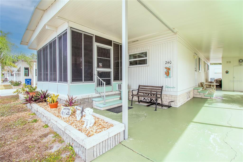 5619 Bayshore Road, Unit 240 Palmetto, FL 34221 - Photo 4 of 33 a front view of a house with outdoor seating