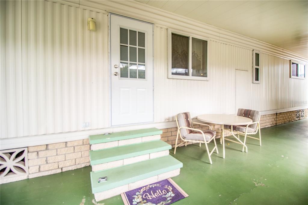 5619 Bayshore Road, Unit 240 Palmetto, FL 34221 - Photo 5 of 33 a balcony with table and chairs