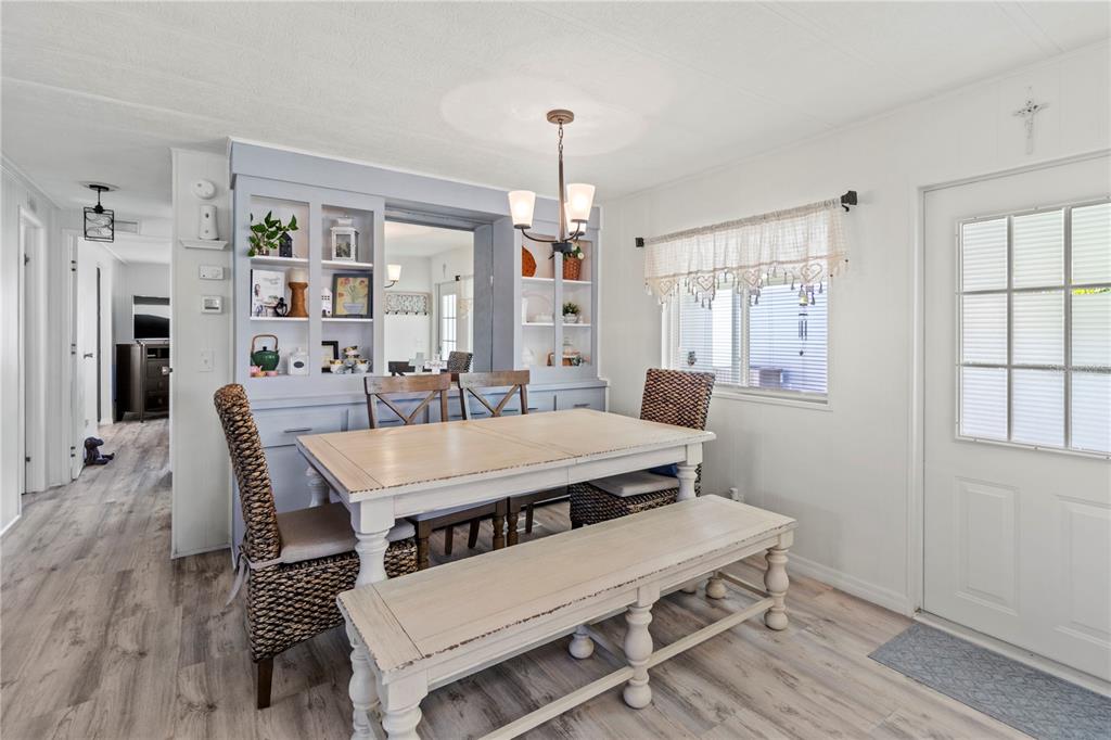 5619 Bayshore Road, Unit 240 Palmetto, FL 34221 - Photo 8 of 33 a view of a dining room with furniture window and wooden floor