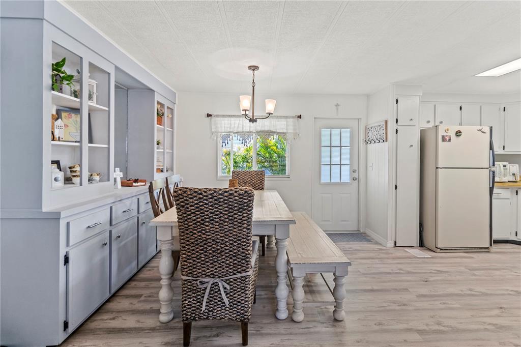 5619 Bayshore Road, Unit 240 Palmetto, FL 34221 - Photo 9 of 33 a dining room with furniture and window