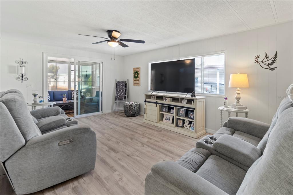 5619 Bayshore Road, Unit 240 Palmetto, FL 34221 - Photo 10 of 33 a living room with furniture and a flat screen tv