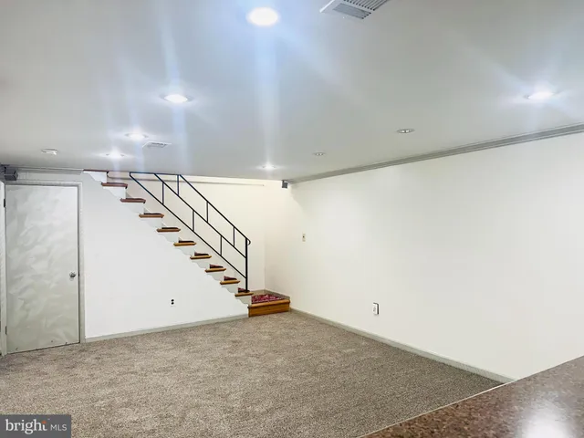 a bathroom with a shower and a sink