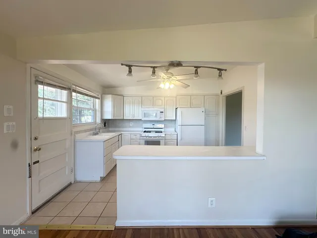 a view of a kitchen with electric appliances