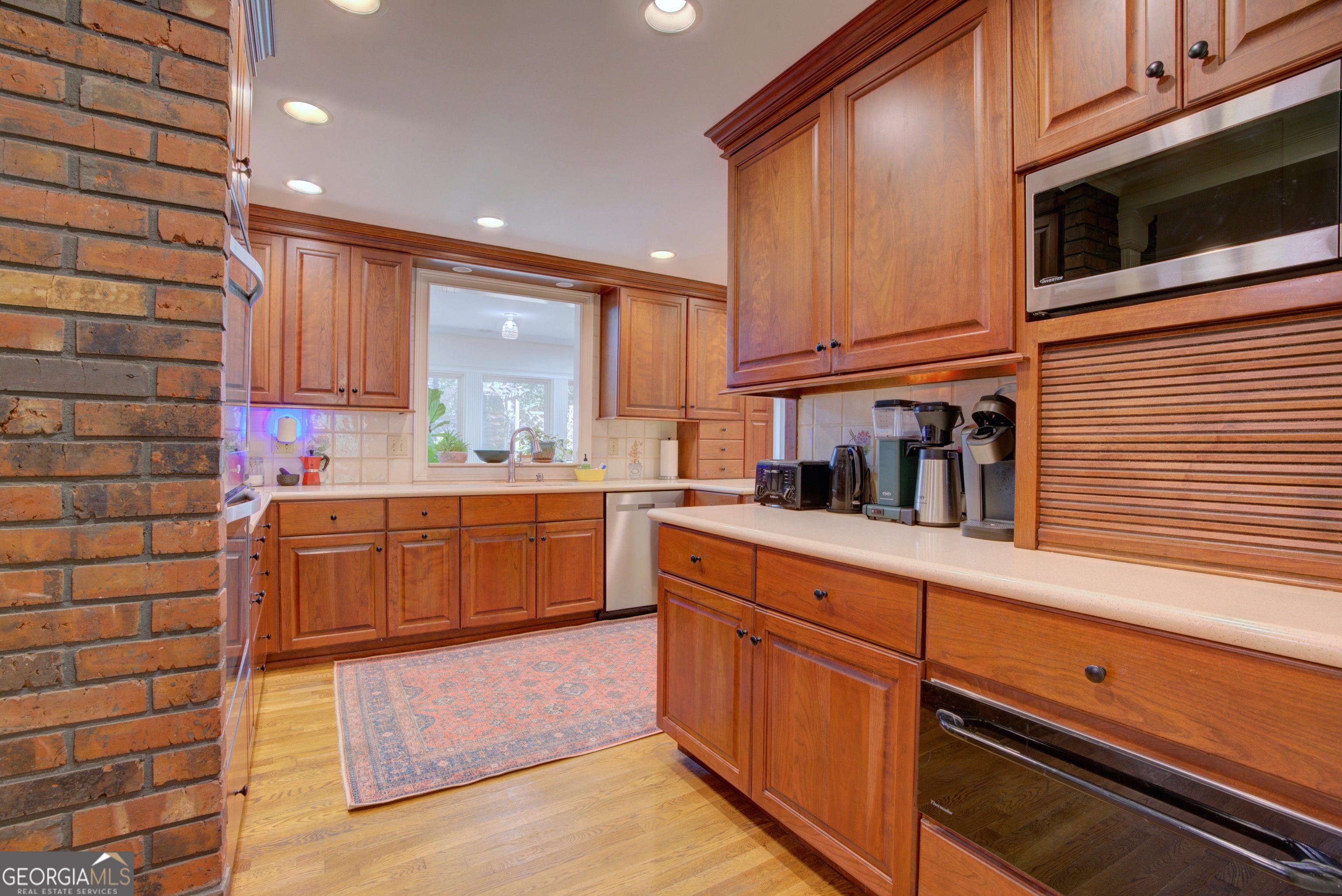 7 Pine Valley Road Rome, GA 30165 - Photo 15 of 57 a kitchen with stainless steel appliances kitchen island granite countertop a stove a sink and a microwave