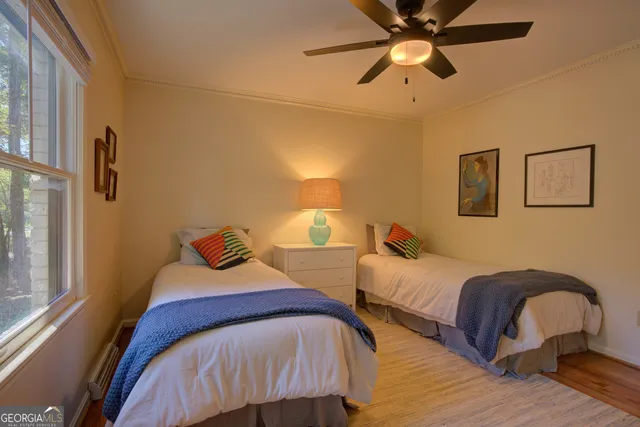 a bedroom with a bed and a night stand