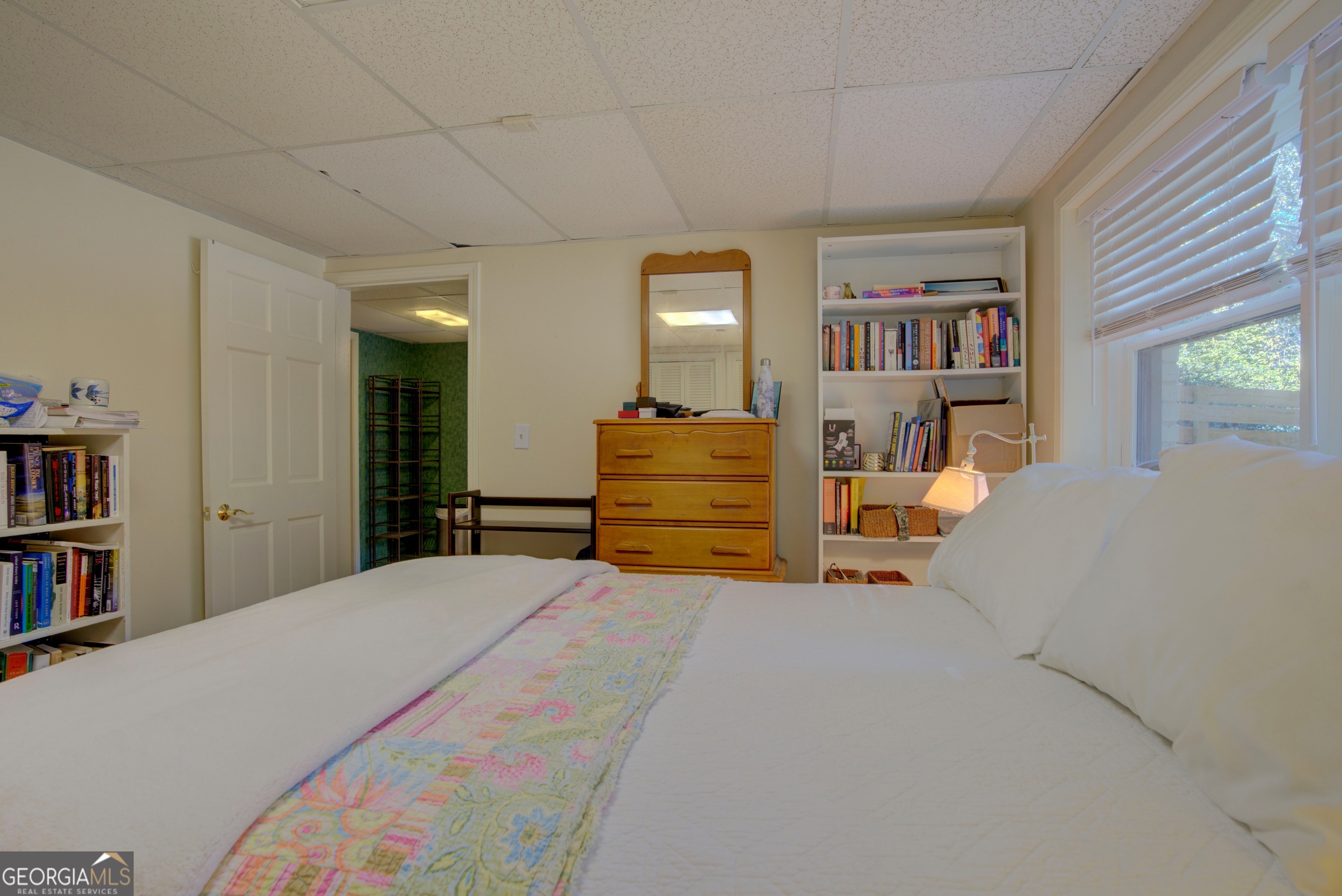 7 Pine Valley Road Rome, GA 30165 - Photo 41 of 57 a bedroom with a bed and a book shelf