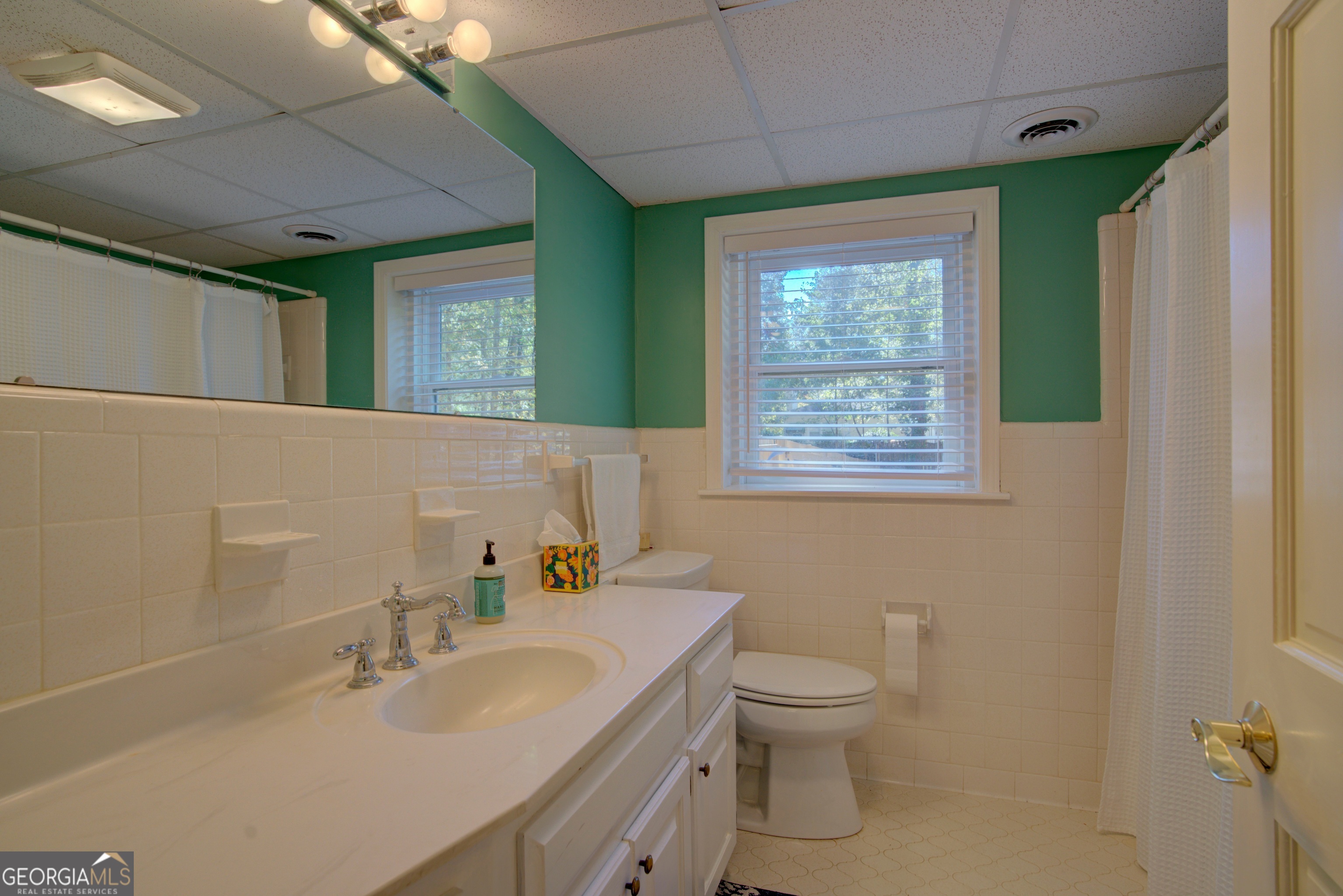 7 Pine Valley Road Rome, GA 30165 - Photo 42 of 57 a bathroom with a toilet sink and mirror