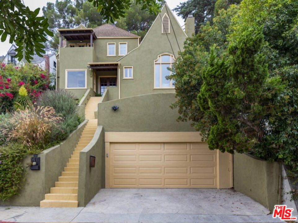 a front view of a house with a garage