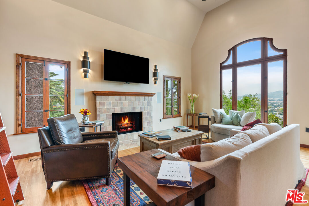1411 Columbia Drive Glendale, CA 91205 - Photo 14 of 45 a living room with furniture a flat screen tv and a fireplace