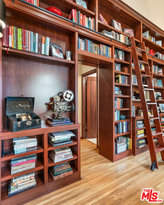 1411 Columbia Drive Glendale, CA 91205 - Photo 16 of 45 a view of a room with lots of books and knick knacks on it