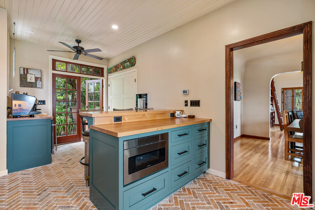 1411 Columbia Drive Glendale, CA 91205 - Photo 24 of 45 a kitchen with a stove and a wooden floor