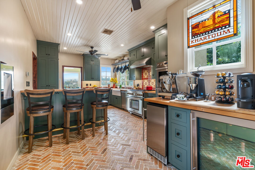 1411 Columbia Drive Glendale, CA 91205 - Photo 27 of 45 a kitchen with lots of counter top space and appliances