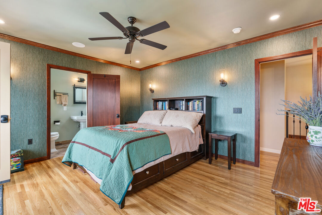 1411 Columbia Drive Glendale, CA 91205 - Photo 32 of 45 a bedroom with a bed and a large mirror