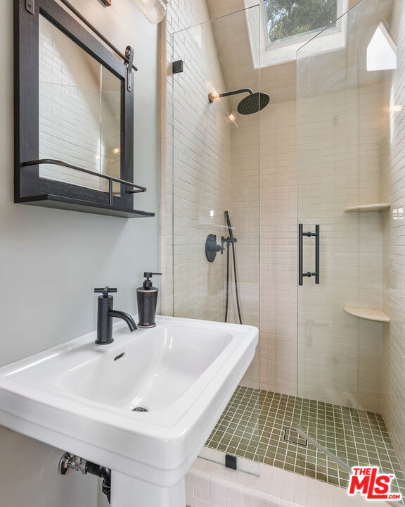 1411 Columbia Drive Glendale, CA 91205 - Photo 33 of 45 a bathroom with a sink a toilet and mirror