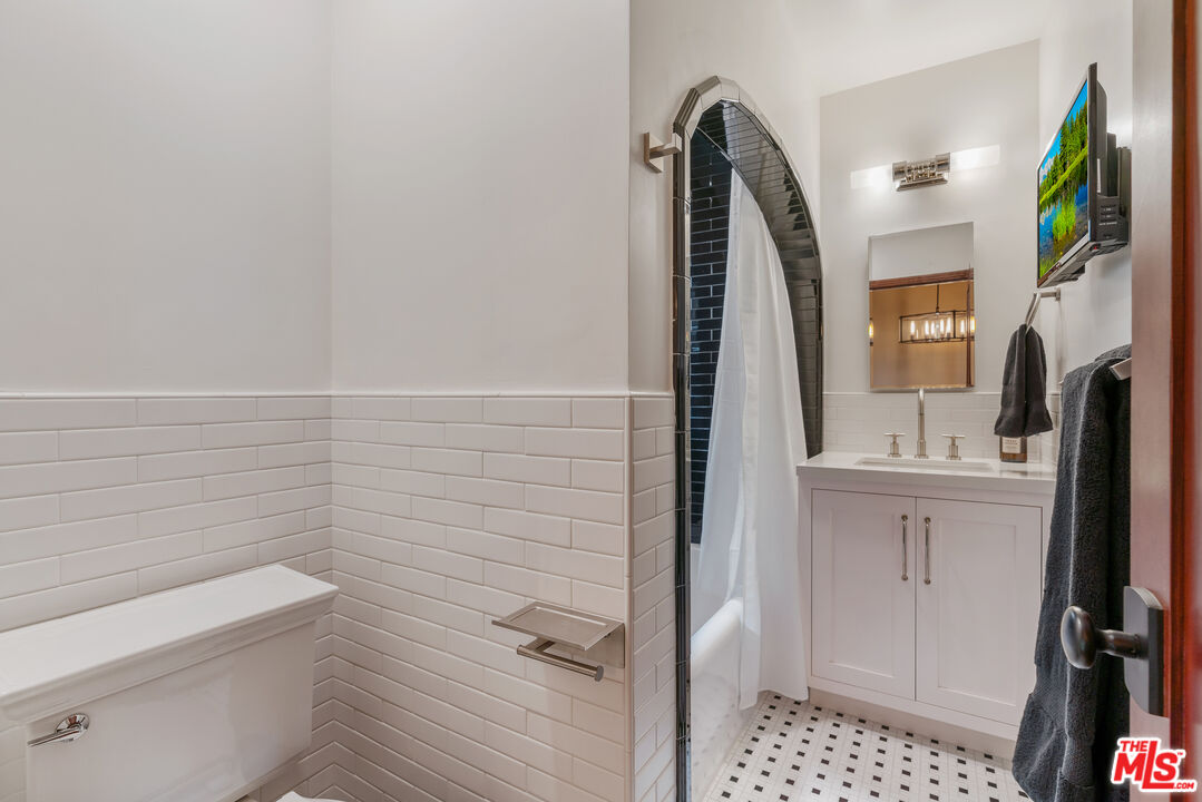 1411 Columbia Drive Glendale, CA 91205 - Photo 36 of 45 a bathroom with a sink a toilet and shower