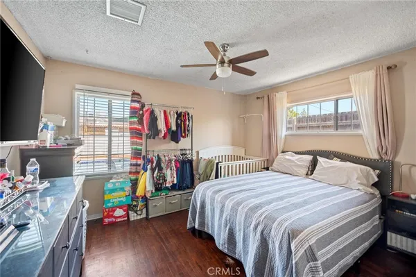 a bedroom with a bed furniture and a window