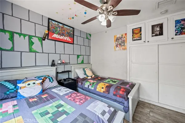 a bedroom that has a bed and a table in it