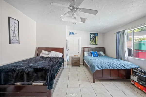 a bedroom with double bed and a window