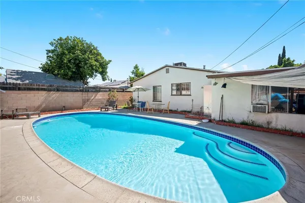 a view of a house with swimming pool