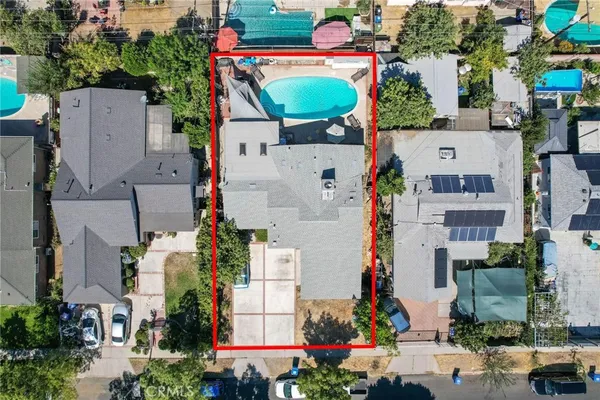 an aerial view of a house with a yard