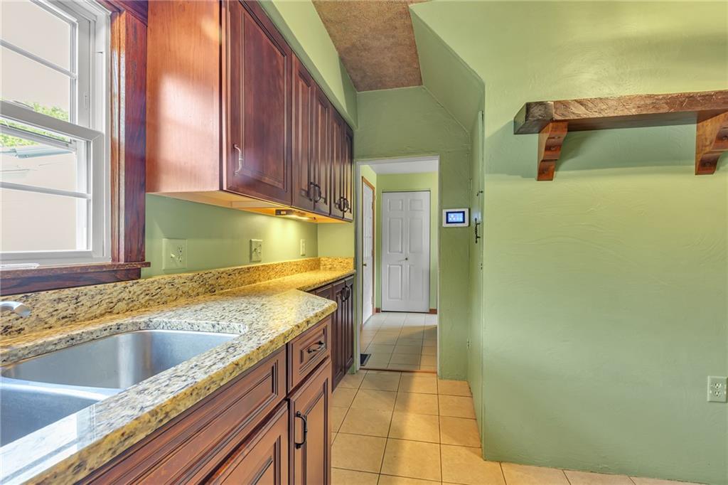 188 Logtown Road Darlington, PA 16115 - Photo 11 of 36 a bathroom with a granite countertop sink and a mirror