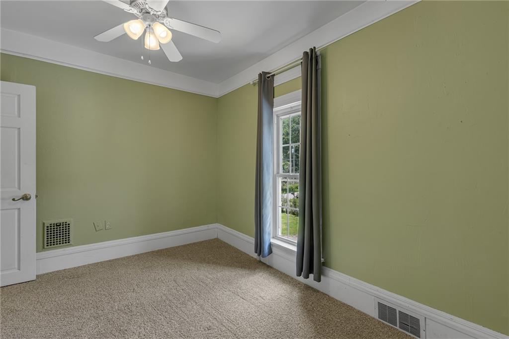 188 Logtown Road Darlington, PA 16115 - Photo 17 of 36 an empty room with a chandelier fan