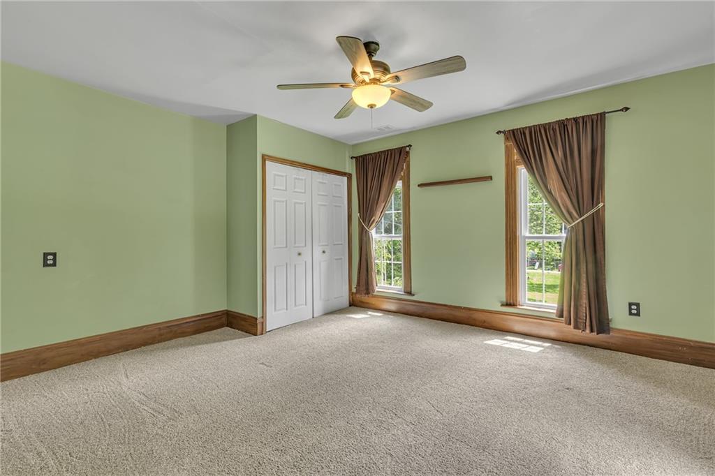 188 Logtown Road Darlington, PA 16115 - Photo 19 of 36 an empty room with closet and a ceiling fan