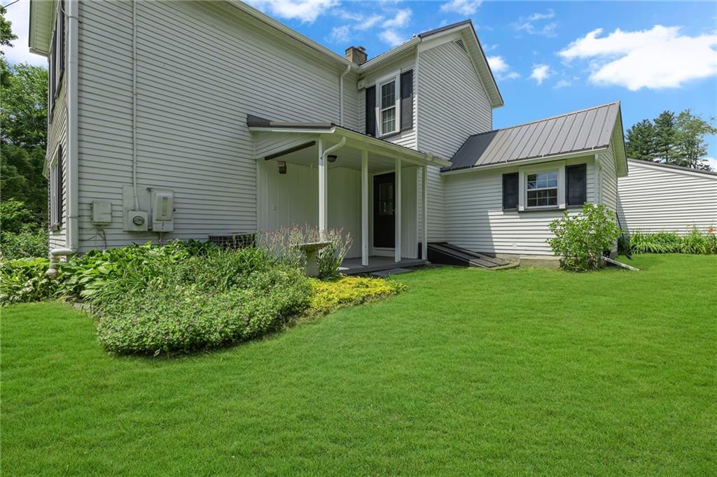 188 Logtown Road Darlington, PA 16115 - Photo 27 of 36 a front view of a house with a garden