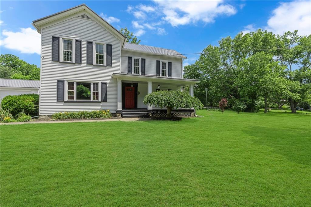 188 Logtown Road Darlington, PA 16115 - Photo 32 of 36 a front view of a house with a garden