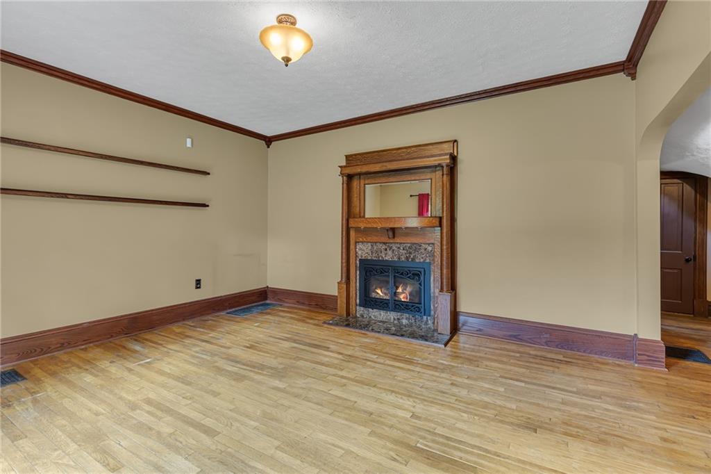 188 Logtown Road Darlington, PA 16115 - Photo 10 of 36 a view of an empty room with a fireplace and a window