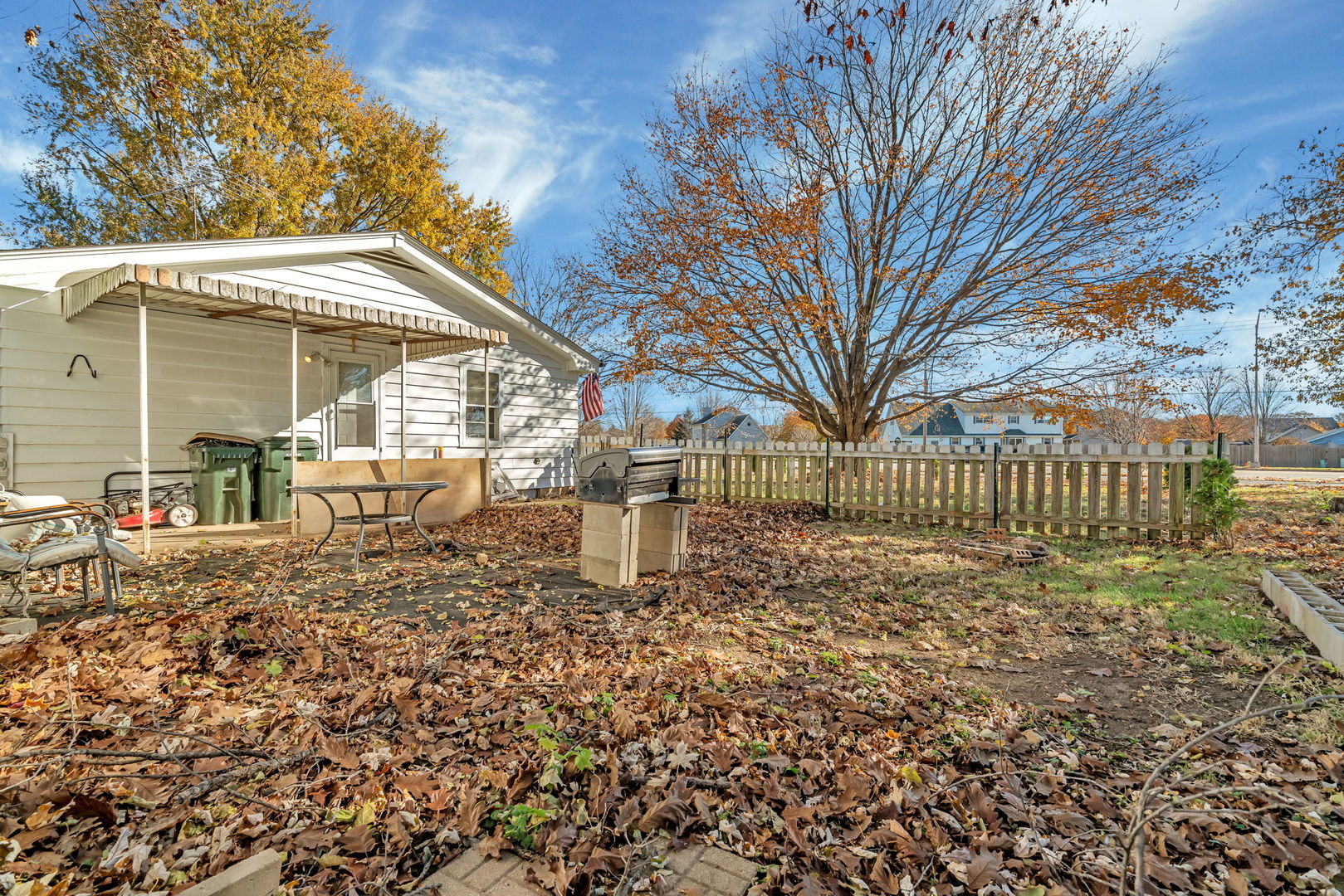 24646 West Eames Street Channahon, IL 60410 - Photo 32 of 32 a view of a house with a small yard and wooden fence