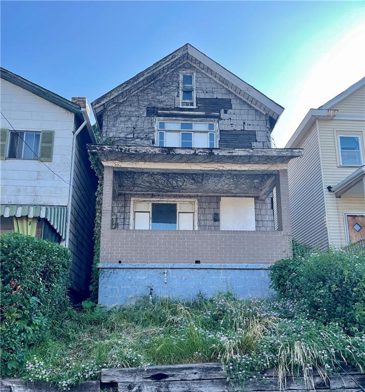 511 Stokes Avenue Braddock, PA 15104 - Photo 1 of 1 front view of a house with a small yard