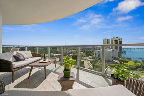 a view of a balcony with chairs and a table