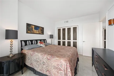 a view of a city from a balcony with furniture